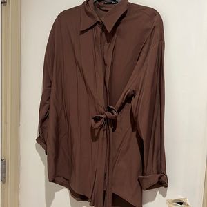 brown shirt with bow